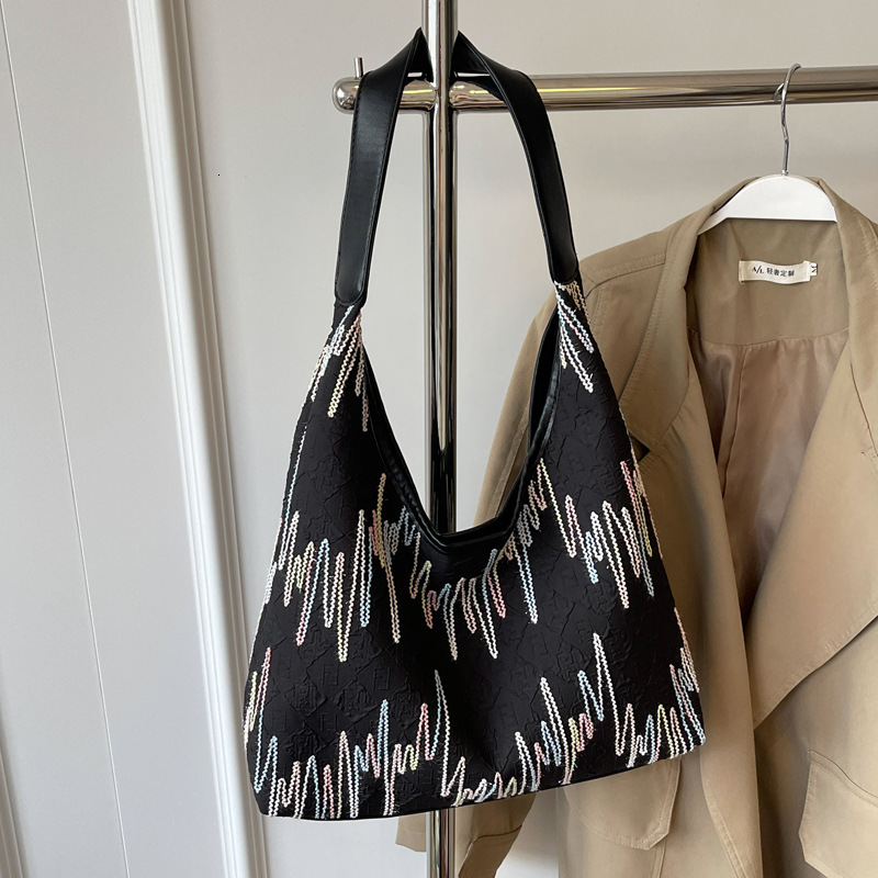 2025S Designer Women S Bag Small Niche Design Canvas Women S Summer Large Capacity New Versatile Armpit Bag High End Single Shoulder Bag