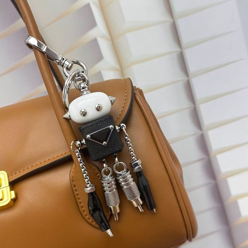 Robot Saffiano leather Metal designer bag charm keychain triangle Personalized metal robot pendant handbag charm for women men Accessories Key Chain dhgate