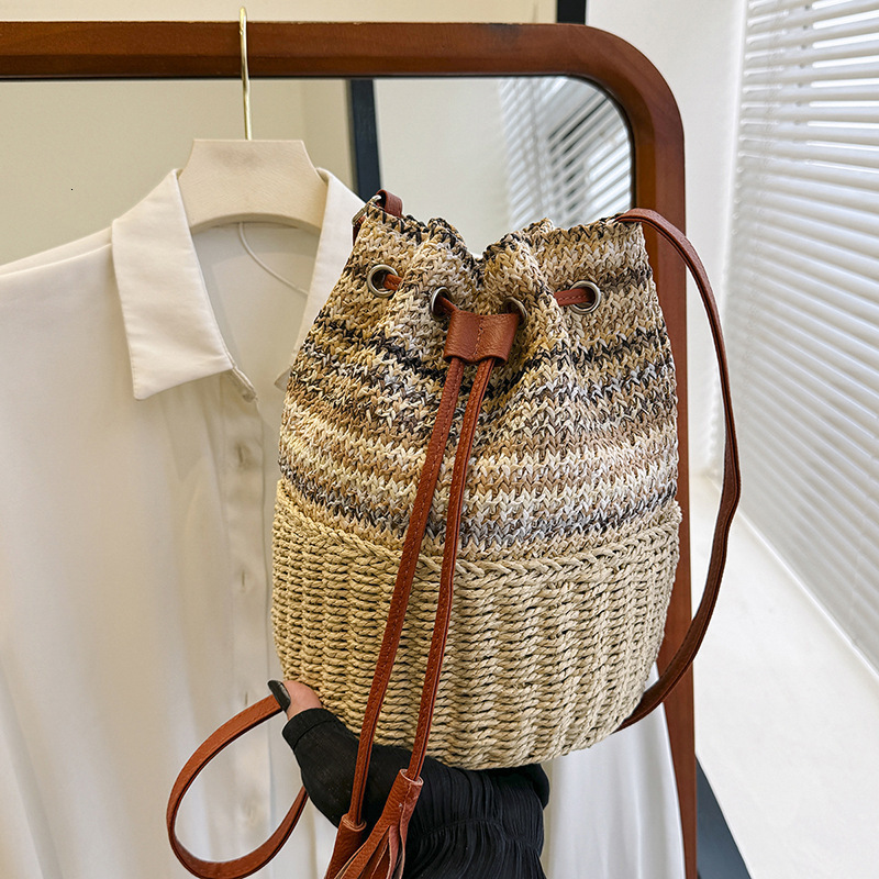 2025S Designer Women S Bag Instagram Bucket Women S Drawstring Single Shoulder Striped Woven Bag Vacation Beach Crossbody Handbag Large Bag