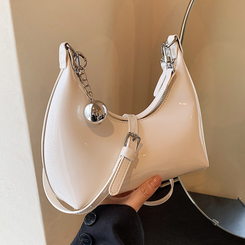 2025S Designer Women S Bag Niche Design Lacquered Underarm New Trendy Shoulder Bag With Bright Face Crossbody Commuter Dumplings For Women