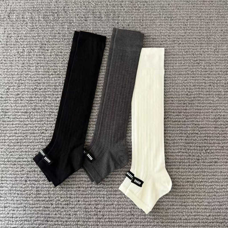 Socks & Hosiery designer Black, white, gray classic M-letter knitted logo show style stylish and versatile ins foot stomping long tube sock cover for women WCQU