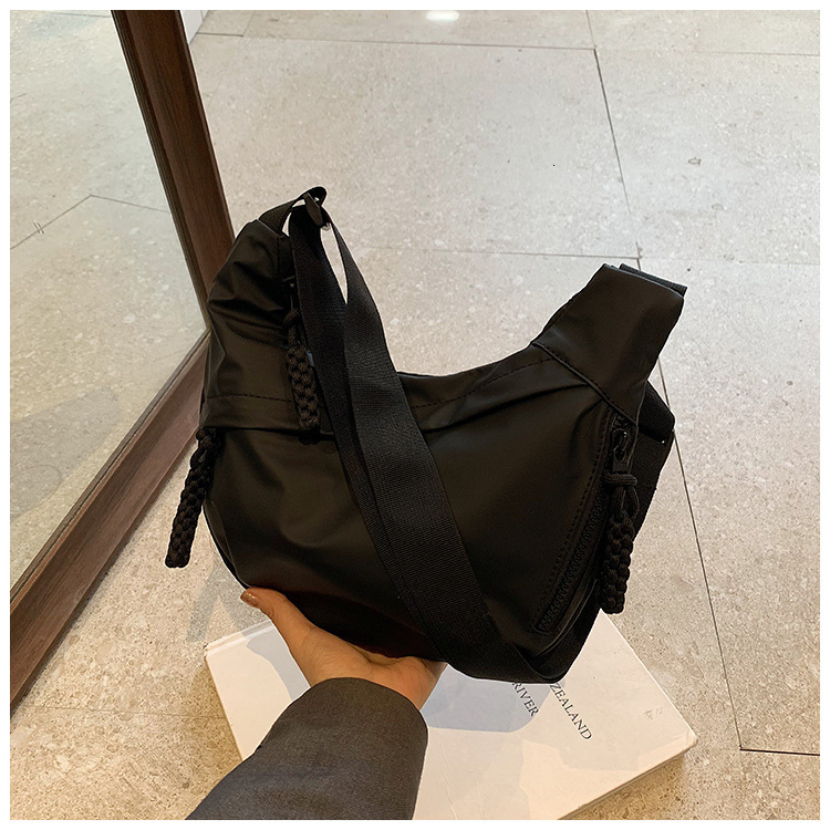 2025S Designer Women S Bag Workwear Style Women S Shoulder Oxford Cloth Ins Canvas Street Large Capacity Artistic Leisure Travel Dumpling Bag