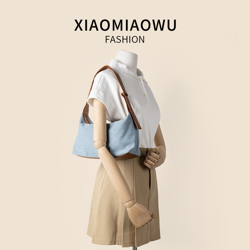 2025S New Model Designer Korean Version Summer New Denim Casual And Artistic Hand Held Shoulder Bag Women S High End PU Niche Style Armpit Bag Totebag