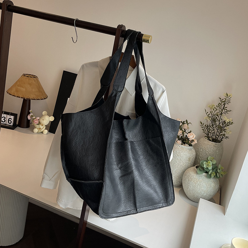 2025S Designer Women S Bag Minimalist New Underarm Soft Leather Large Capacity Shoulder Handheld Solid Color Versatile Tote Bag