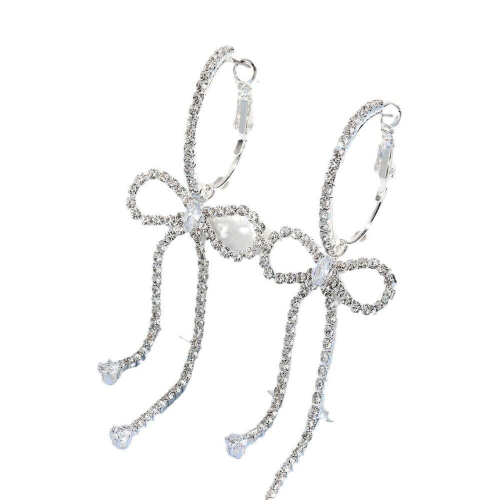 Korean socialite's urious and high-end style with dia studded bow, long tassel earrings, niche design, temperament, rhie earrings