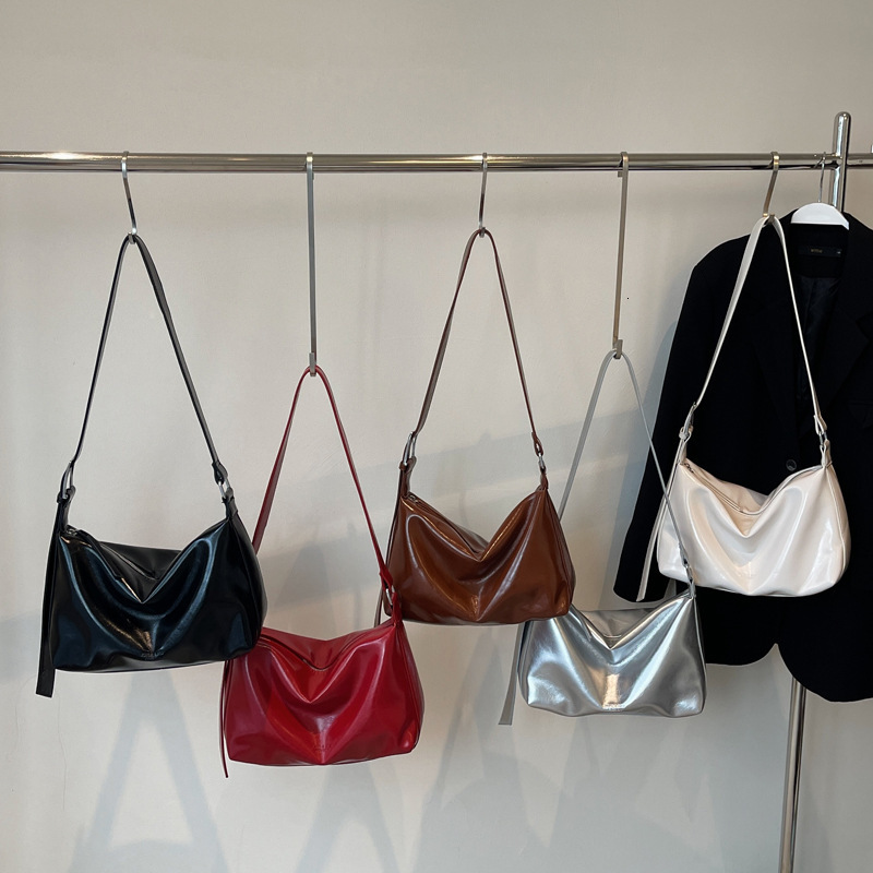 2025S Designer Women S Bag Autumn And Winter Handheld Tote Premium Oil Feeling Wax Leather Underarm Bag Niche Fashion Texture Single Shoulder Crossbod