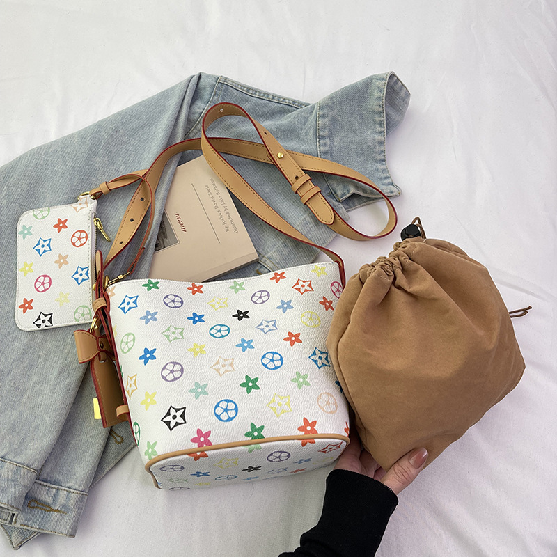 Design sense white tri-color multi-purpose bucket bag hand bag new niche large capacity hand crossbody shoulder bag 2025