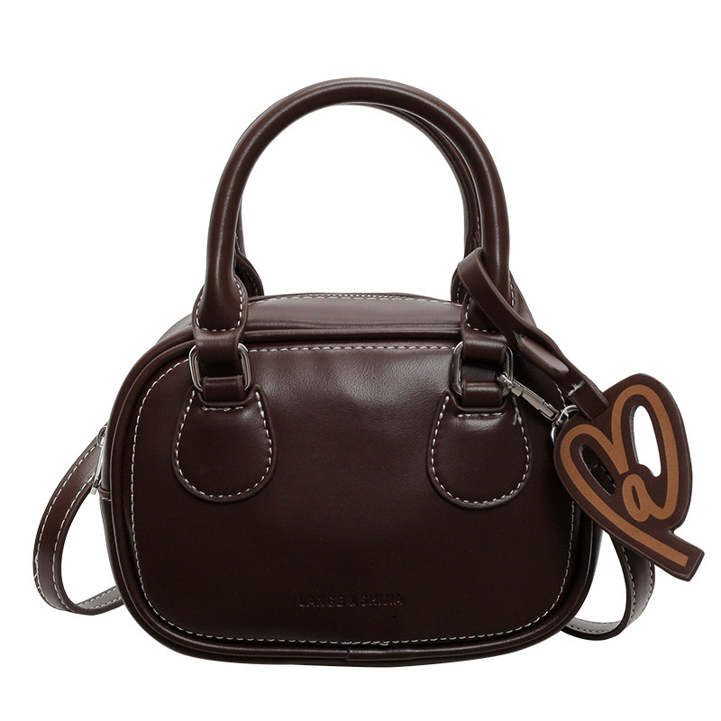 2025S Designer Women S Bag Simple Texture Toast Single Shoulder Women S Autumn New Fashion Versatile Crossbody Handbag Boston Bag