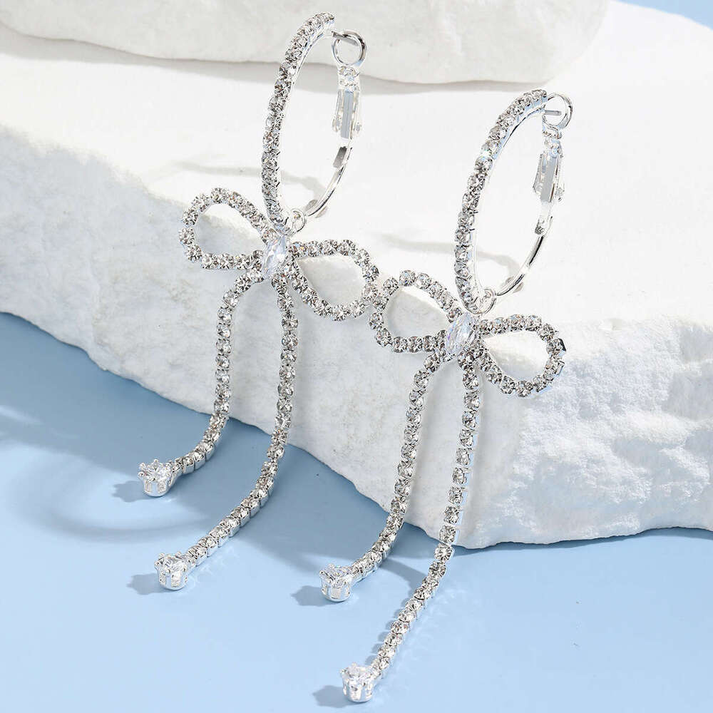 Korean socialite's urious and high-end style with dia studded bow, long tassel earrings, niche design, temperament, rhie earrings