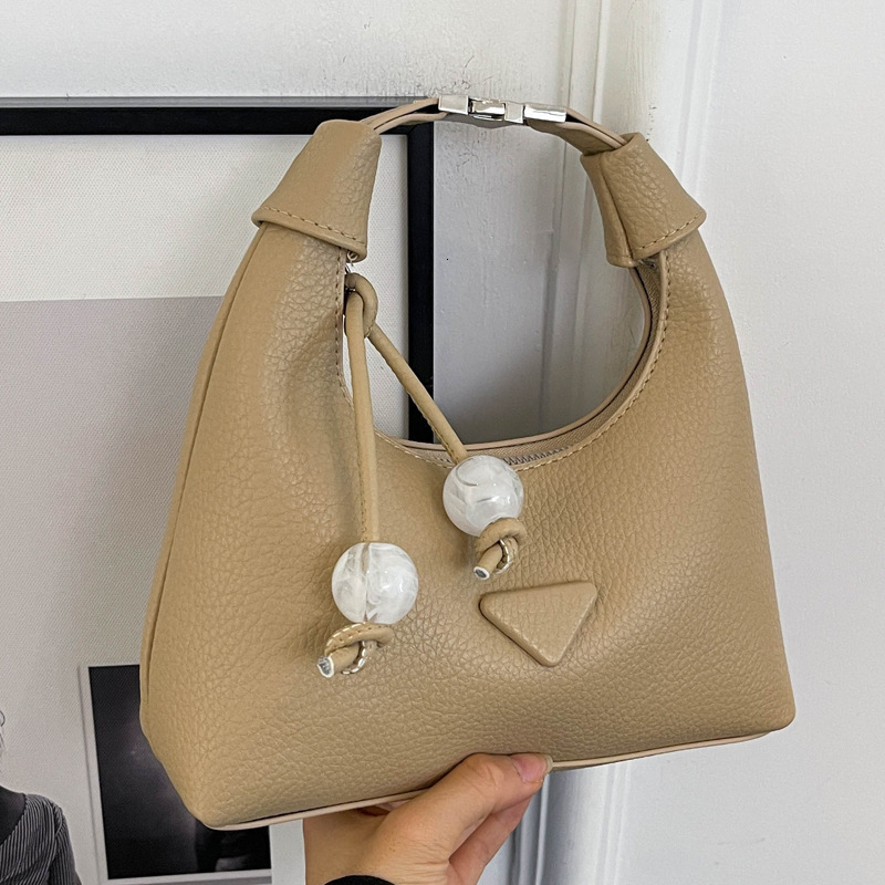 2025S Designer Women S Bag Simple Handheld Small For Women New Trendy Versatile Daily Matching Crossbody Solid Color Korean Dumpling Bag