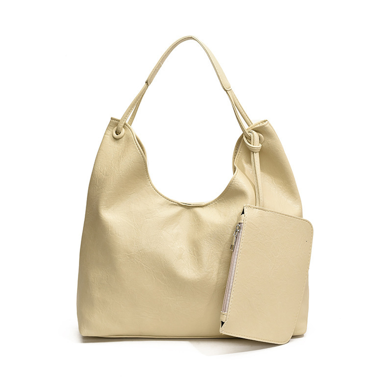 2025S Designer Women S Bag New Large Capacity Bucket Fashionable And Versatile Casual Commuting Tote Bag Niche Single Shoulder Armpit Bag