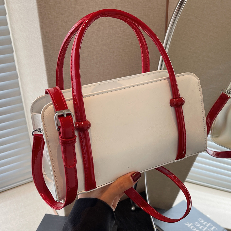 2025S Designer Women S Bag Boston Contrasting Color Handbag New Fashionable Versatile Pillow Trendy And Flowing Single Shoulder Diagonal Cross Bag