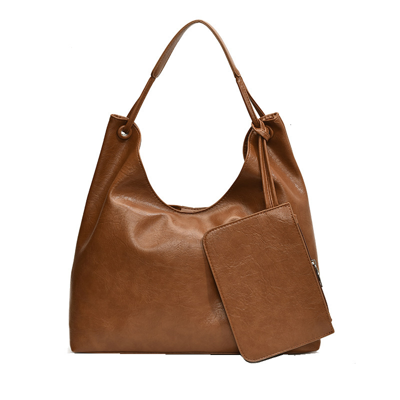 2025S Designer Women S Bag New Large Capacity Bucket Fashionable And Versatile Casual Commuting Tote Bag Niche Single Shoulder Armpit Bag