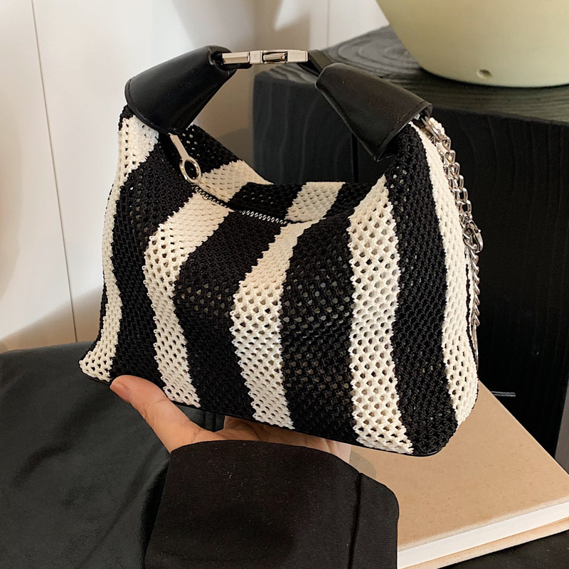 2025S Designer Women S Bag Summer Bucket Bag High End Exquisite Women S New Black And White Striped Hand Held Armpit Bag