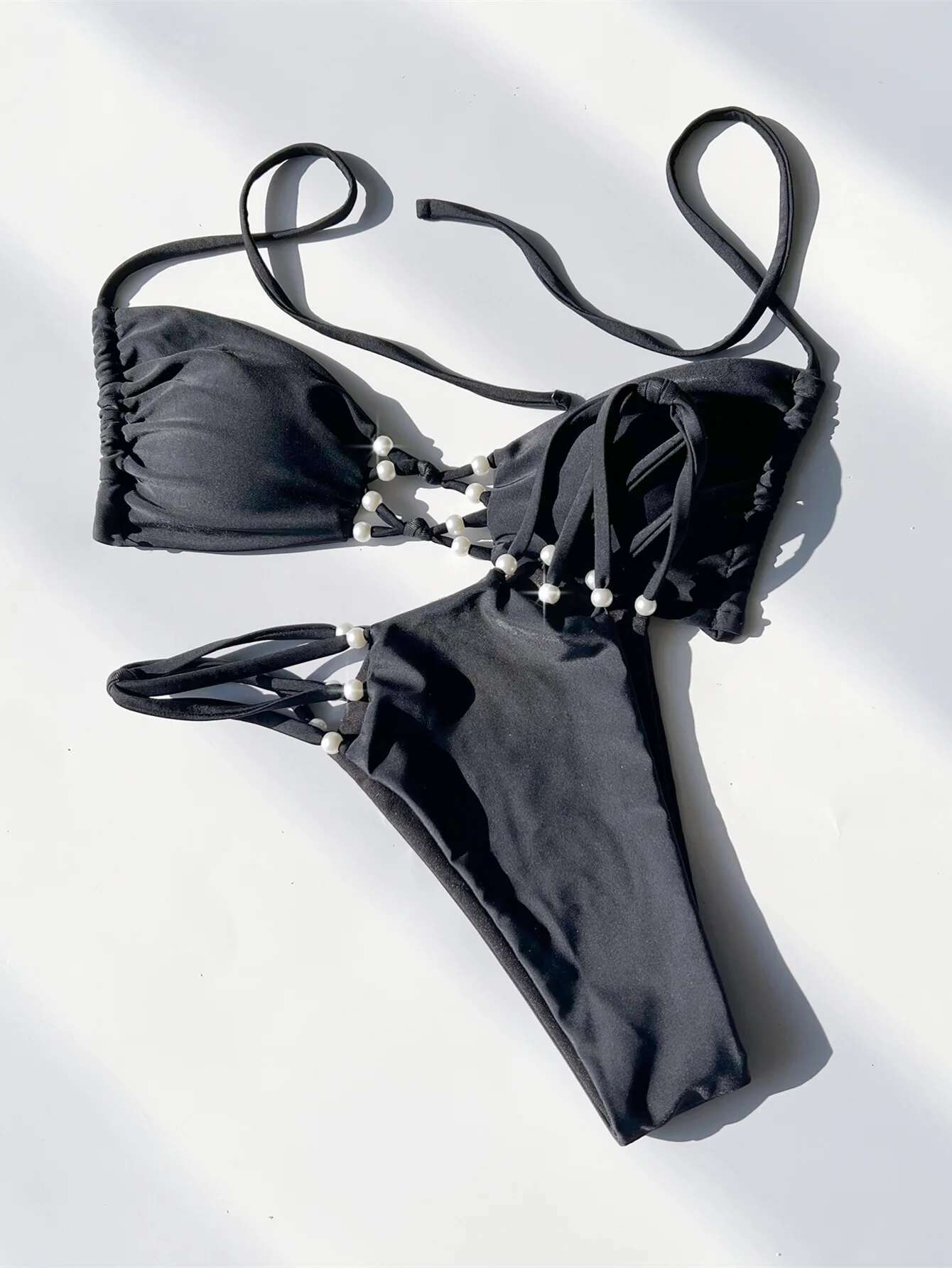 Dongdumaoyi Sexy Hollow Out Backless Thong Bikini Women Black Pearls Push Up Bandage Micro Swimsuit Summer Beach Bathing Suit Swimwear
