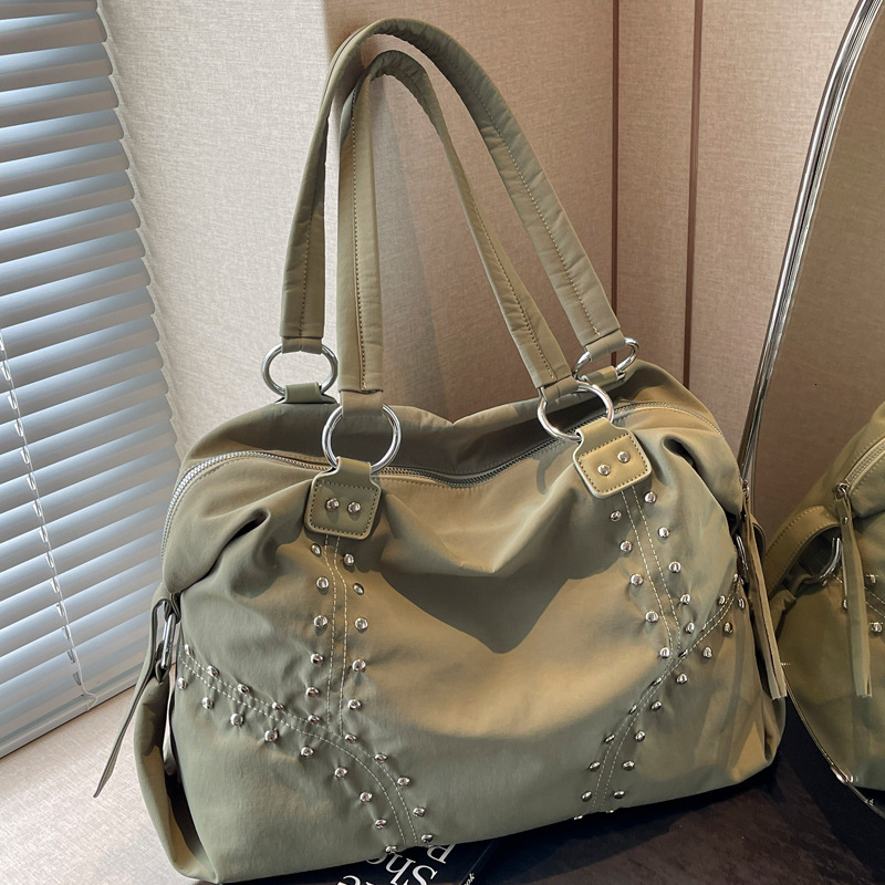 2025S Designer Women S Bag Autumn Popular Soft Cloth Rivet Shoulder Fashionable Large Capacity Tote Bag Casual Versatile Commuting Armpit Bag