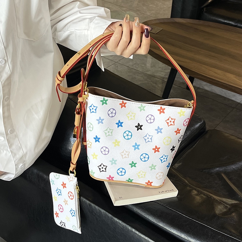 Design sense white tri-color multi-purpose bucket bag hand bag new niche large capacity hand crossbody shoulder bag 2025