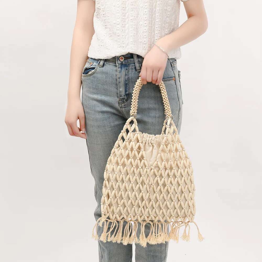 NEW Women Woven Tassels Design Hollow-Out Wooden Bead Tote Bucket Shoulder Bag Female Reticulate Netted Canvas Beach Handbag