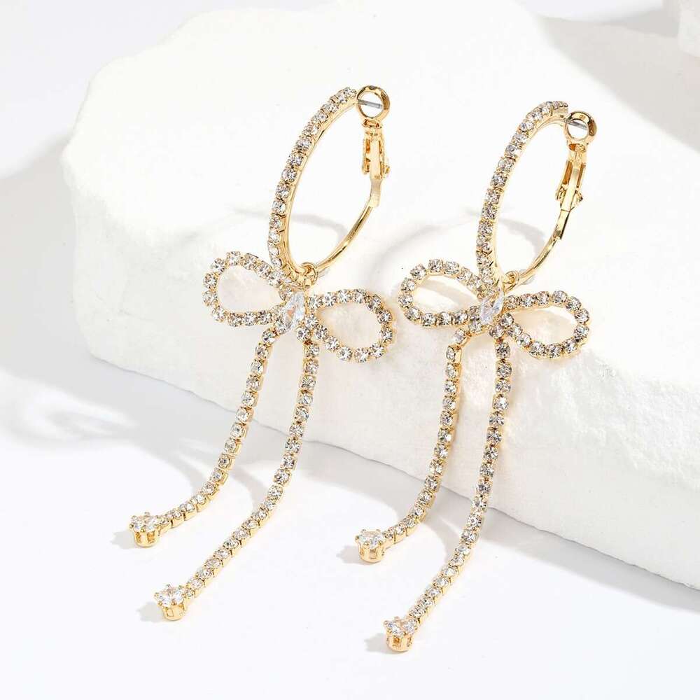 Korean socialite's urious and high-end style with dia studded bow, long tassel earrings, niche design, temperament, rhie earrings