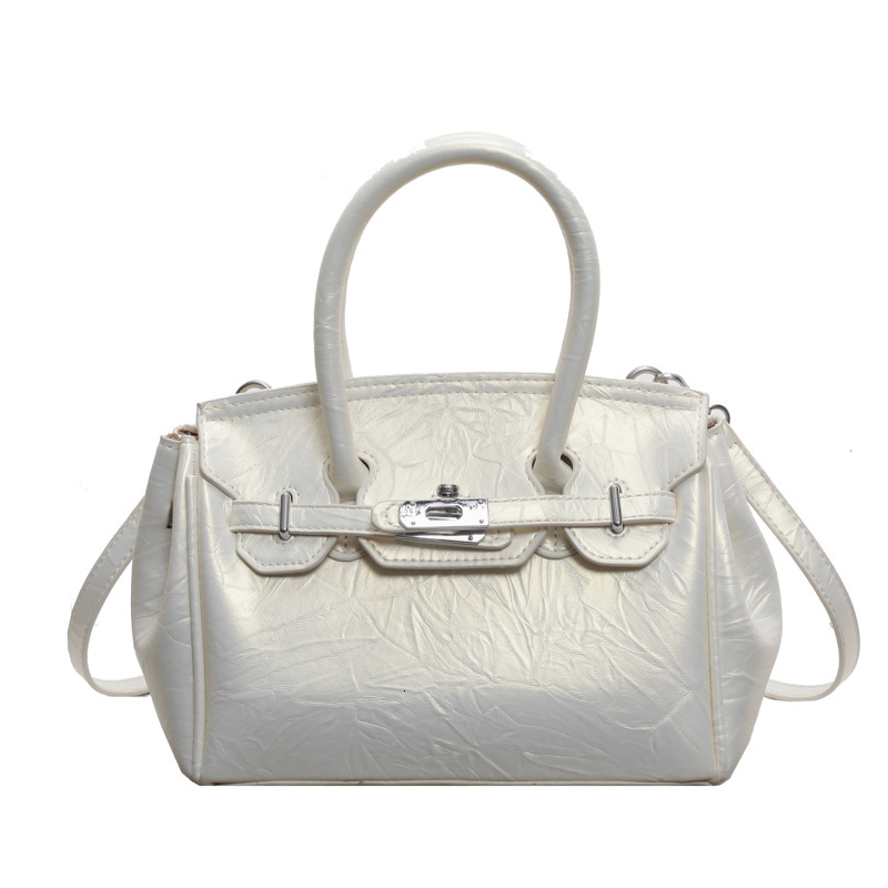 2025S Designer Women S Bag Korean Fashion Handheld Women S Bag Summer New Collection Simple Texture Single Shoulder Kelly Bag Niche Design Diagonal Cr