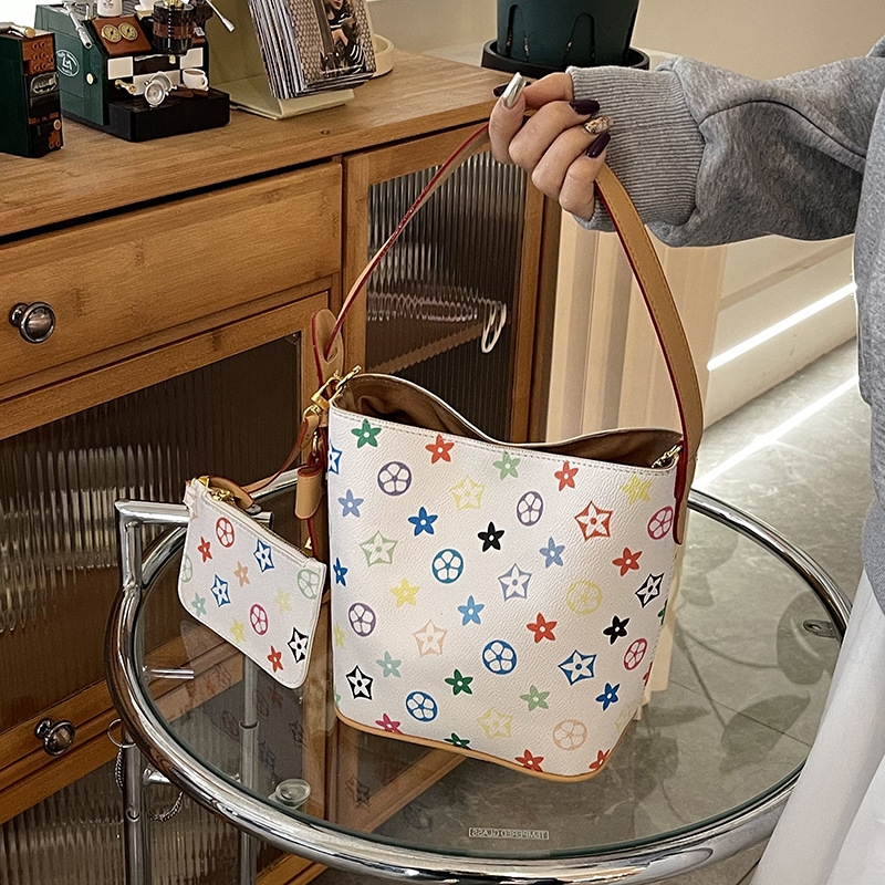 Design sense white tri-color multi-purpose bucket bag hand bag new niche large capacity hand crossbody shoulder bag 2025