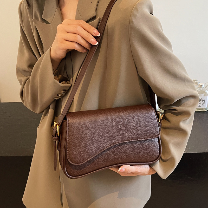 2025S Designer Women s Bag New Flip Fashion Simple Style Armpit Small Square Bag Mini Handbag High end Texture Crossbody Bag Outdoor Casual Handbag Sa