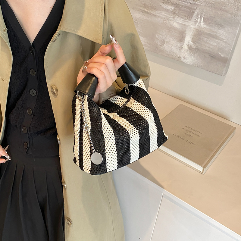 2025S Designer Women S Bag Summer Bucket Bag High End Exquisite Women S New Black And White Striped Hand Held Armpit Bag