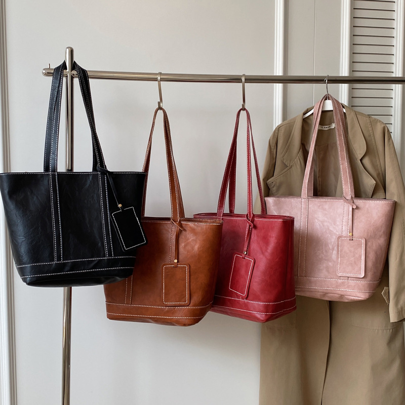 2025S Designer Women S Bag Fashionable Large Capacity Handbag For Work Shopping Commuting Simple Tote Bag Textured Casual One Shoulder Armpit Bag