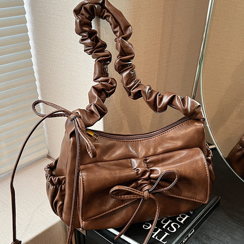 2025S Designer Women S Bag Pleated Armpit Women S New Fashionable Commuting Shoulder Bag High End Sense Niche Bow Crossbody Bag