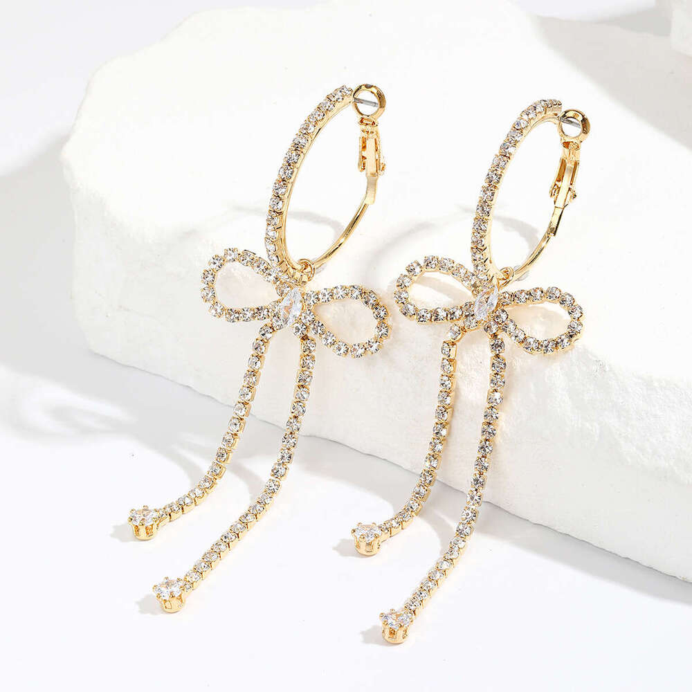 Korean socialite's urious and high-end style with dia studded bow, long tassel earrings, niche design, temperament, rhie earrings