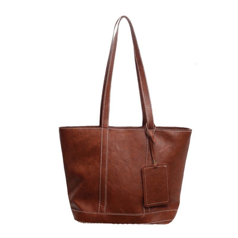 2025S Designer Women S Bag Fashionable Large Capacity Handbag For Work Shopping Commuting Simple Tote Bag Textured Casual One Shoulder Armpit Bag