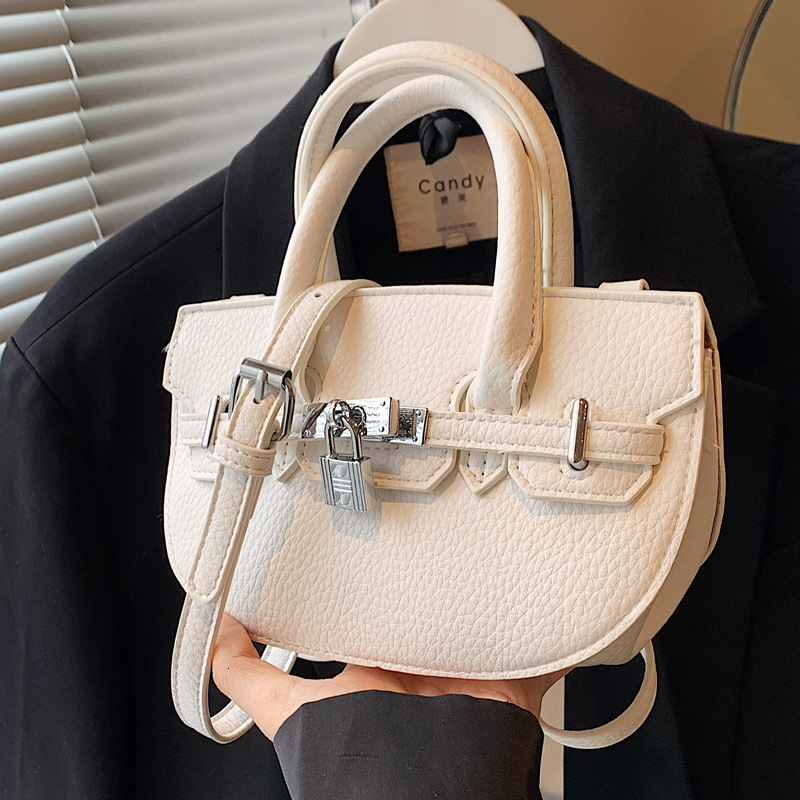 2025S Designer Women S Bag Handheld Kelly Women S Summer Versatile Light Luxury Commuting Oval Shoulder Bag High End Buckle Women Bags