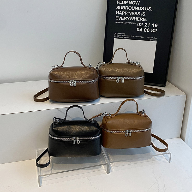 2025S Designer Women S Bag Small Niche Hand Held Box For Women New Fashionable Simple Crossbody Solid Color Versatile Western Style Shoulder Bag