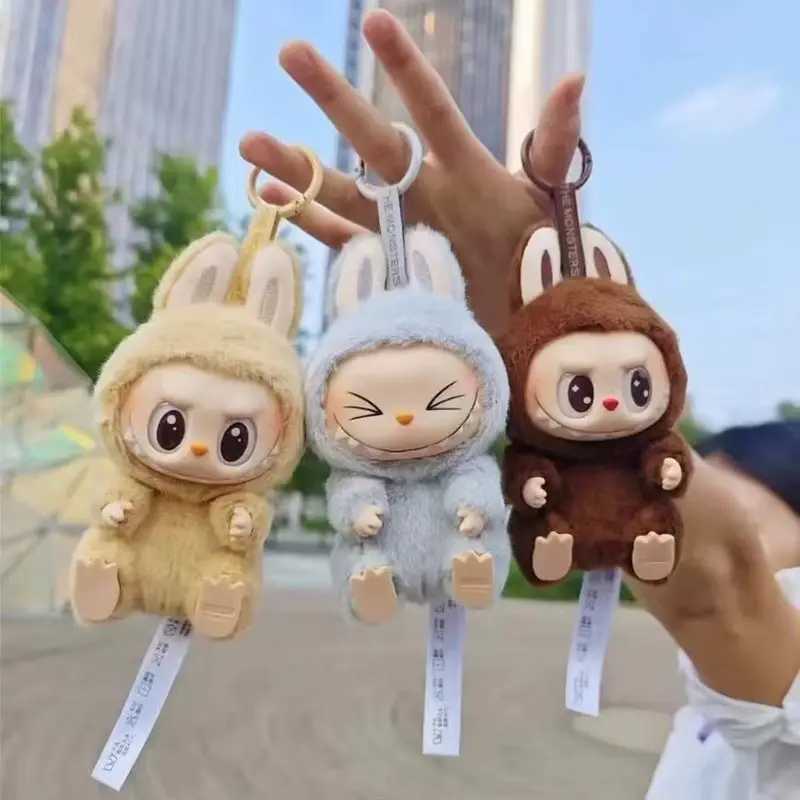 The real monster Labubu has a seat series character vinyl base doll cute Labubu action character animation model doll keychain toyT250407