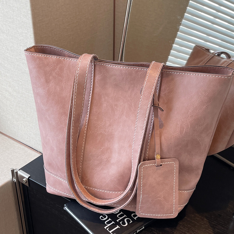 2025S Designer Women S Bag Fashionable Large Capacity Handbag For Work Shopping Commuting Simple Tote Bag Textured Casual One Shoulder Armpit Bag