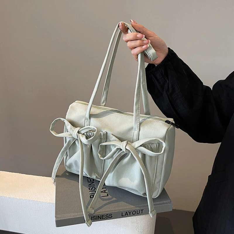 2025 New Korean Bow Nylon Shoulder Fashionable And Sweet Design Tote Bag Folded Large Capacity Commuter Women's Handbag