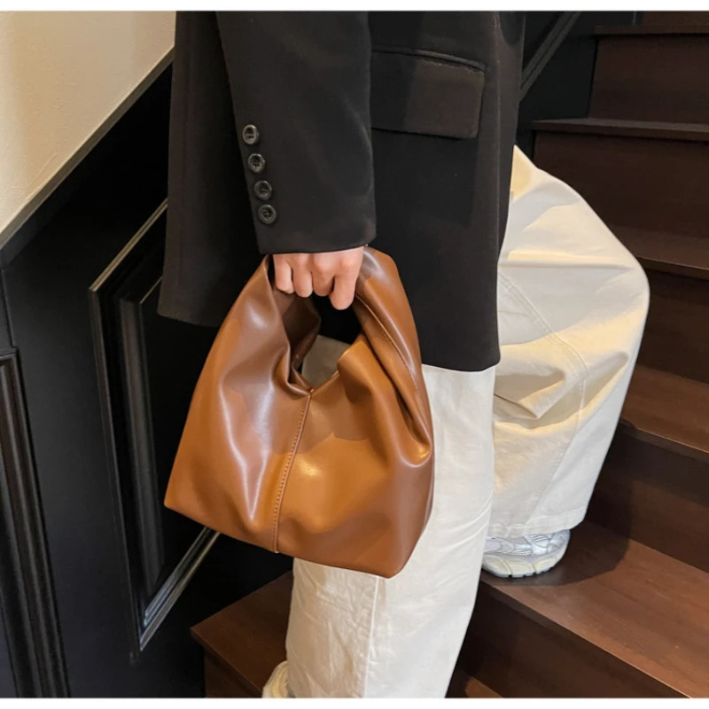 pleated fashionable solid color cloud bag simple and elegant soft leather handheld garbage bag 250402