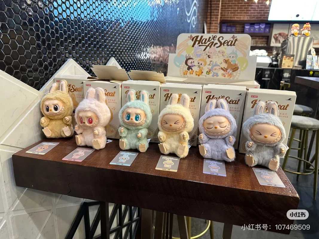 The real monster Labubu has a seat series character vinyl base doll cute Labubu action character animation model doll keychain toyT250407