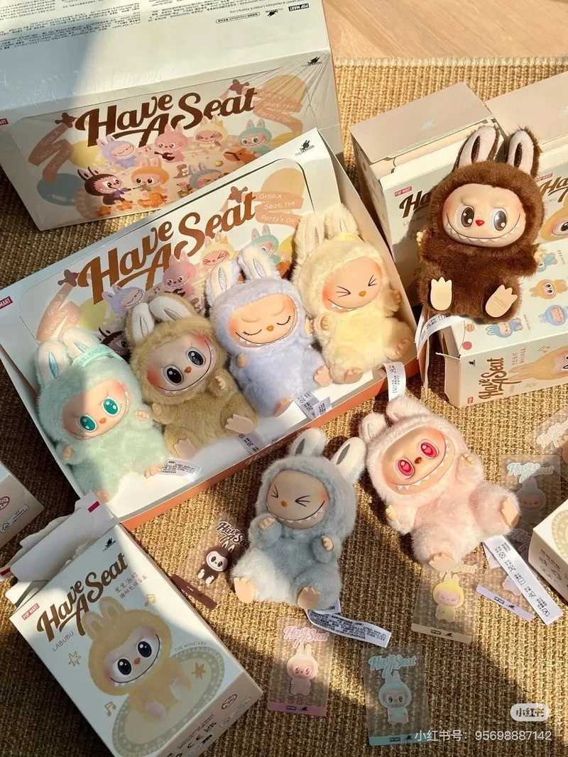 The real monster Labubu has a seat series character vinyl base doll cute Labubu action character animation model doll keychain toyT250407
