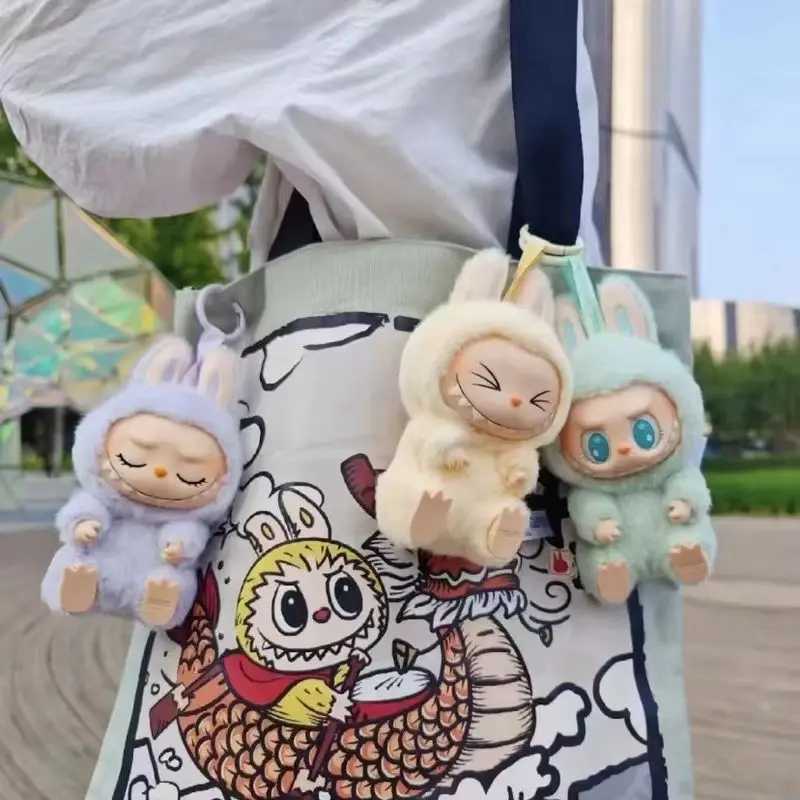 The real monster Labubu has a seat series character vinyl base doll cute Labubu action character animation model doll keychain toyT250407