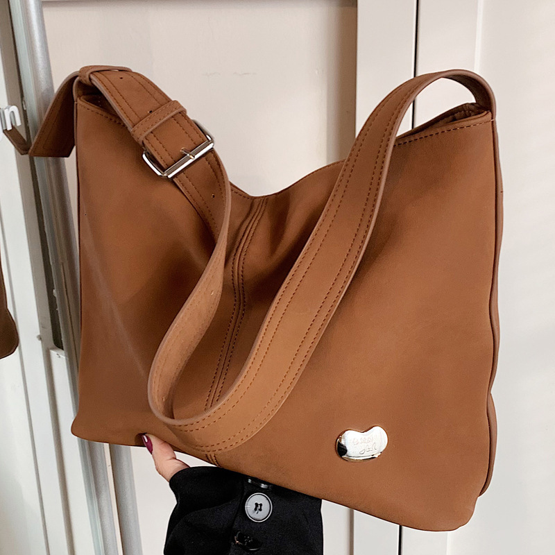 2025S Designer Women S Bag New Shoulder Niche Simple Solid Color Tote Versatile Commuting Lightweight Large Capacity Armpit Bag