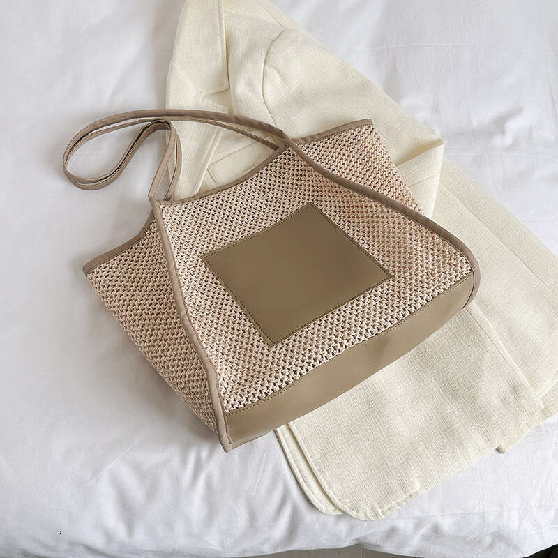 Design sense grass woven for women with large capacity hollowed out single shoulder beach bun mother commuting tote bag 2025 new casual versatile fash