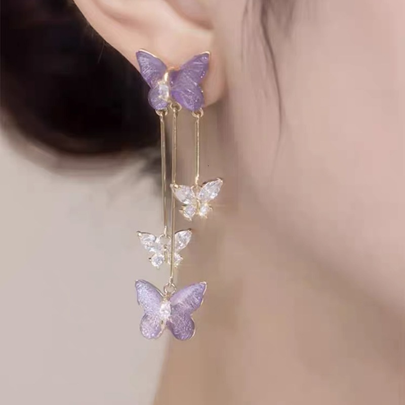 Digging into treasure, which girl would refuse the super beautiful purple crystal butterfly earrings, tassel style earrings
