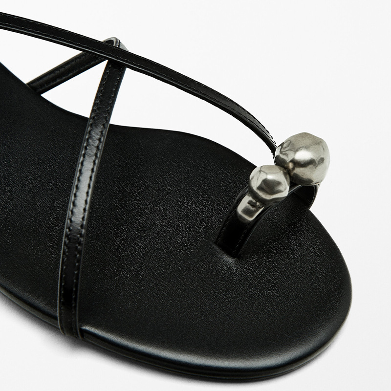 hot 2025 Women's genuine leather metal toe-ring Roman summer style open-toe flat sole one-word cross strap sandals new design