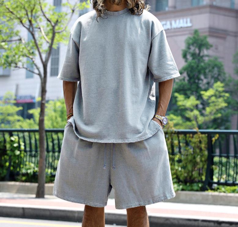 Crossing the border between Europe and United States with casual mens clothing in solid color loose short sleeved simple street trend style set 250326