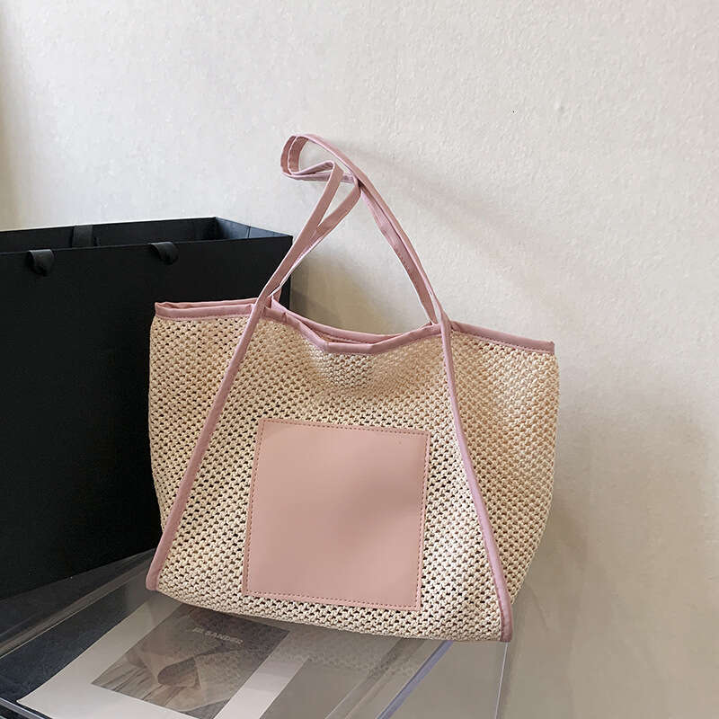 Design sense grass woven for women with large capacity hollowed out single shoulder beach bun mother commuting tote bag 2025 new casual versatile fash
