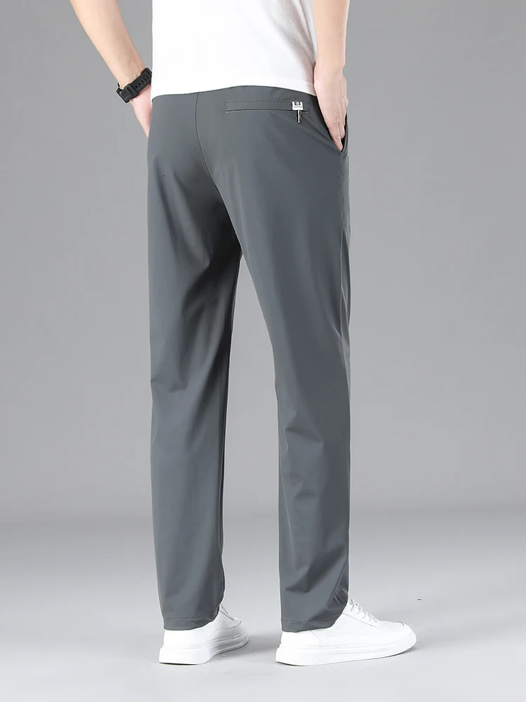 Mens clothing highquality casual pants summer thin ice silk straight stretch waist jogging sports mens Trouser 250403