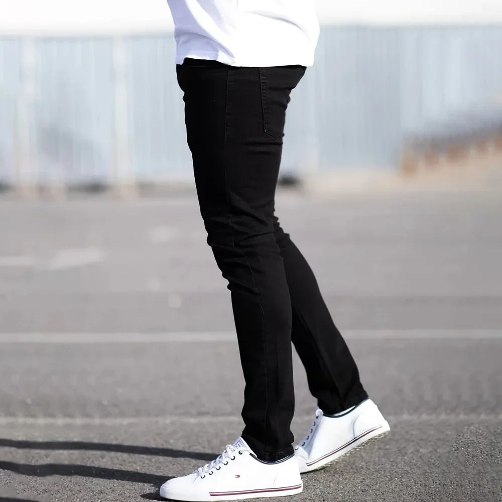 Spring mens black and blue pants solid color elastic jeans street casual slim fit tight 250408