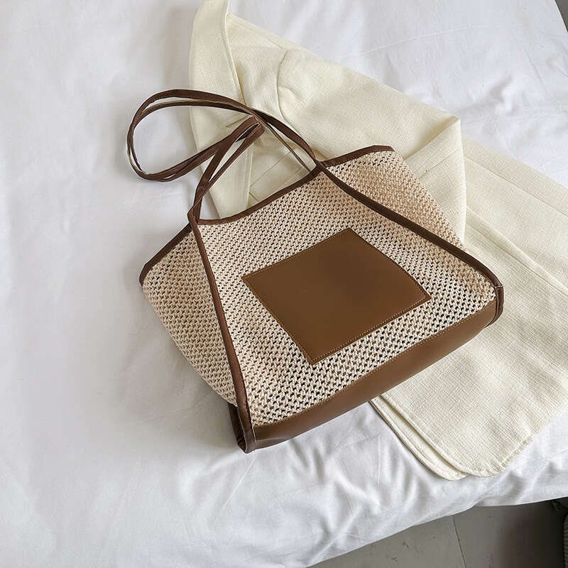 Design sense grass woven for women with large capacity hollowed out single shoulder beach bun mother commuting tote bag 2025 new casual versatile fash