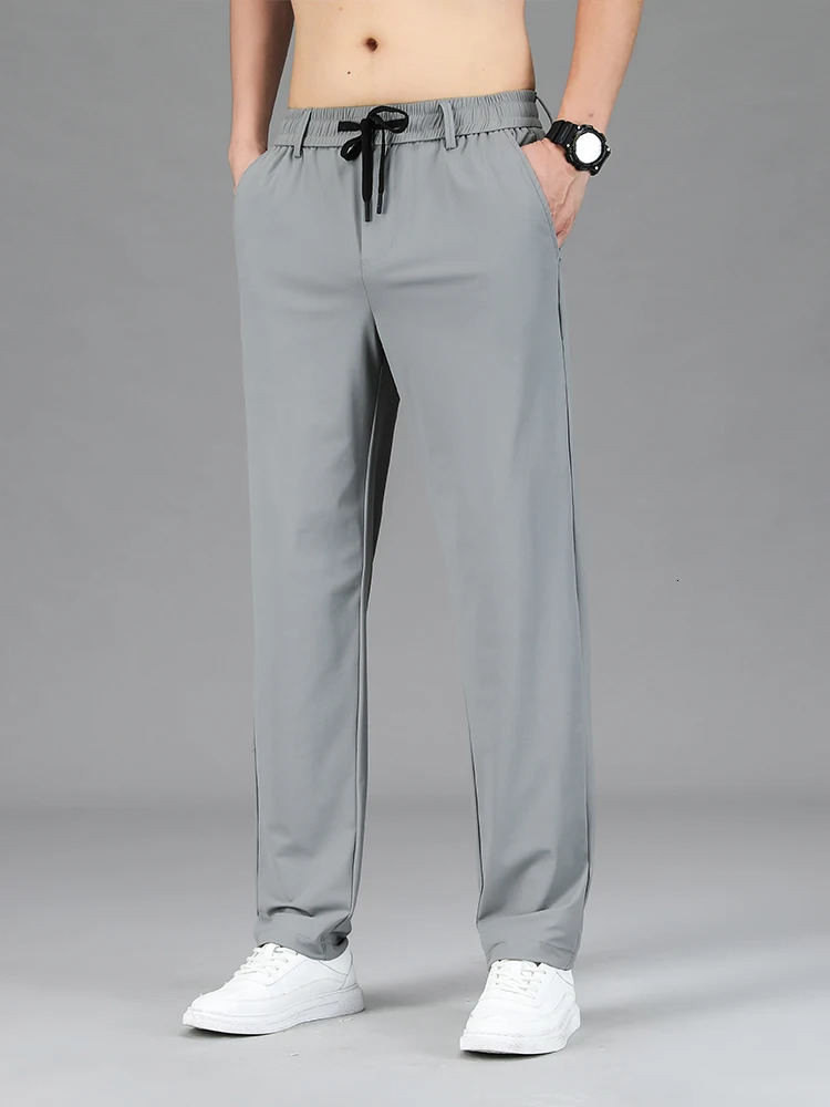 Mens clothing highquality casual pants summer thin ice silk straight stretch waist jogging sports mens Trouser 250403